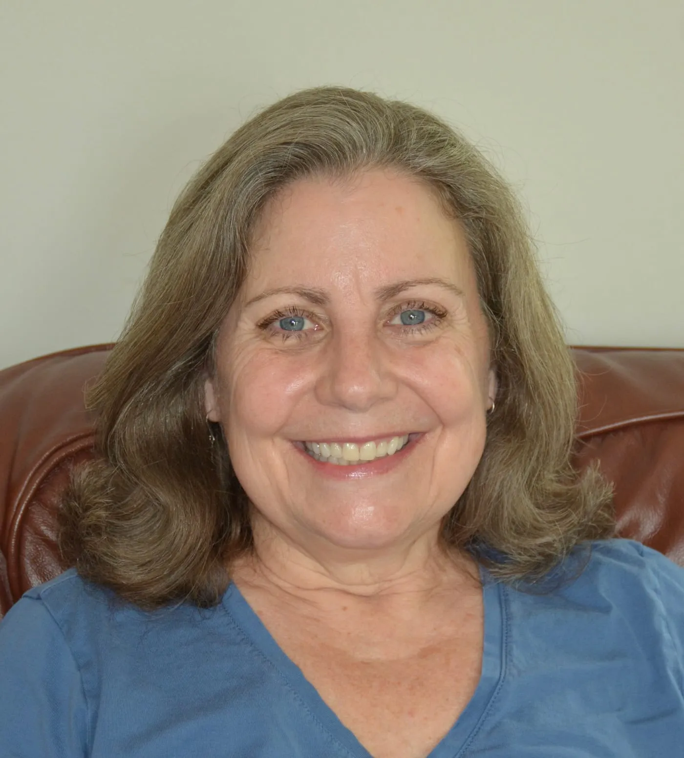 Carol Roddy, Certified Bowenwork Practitioner, smiling in her treatment room